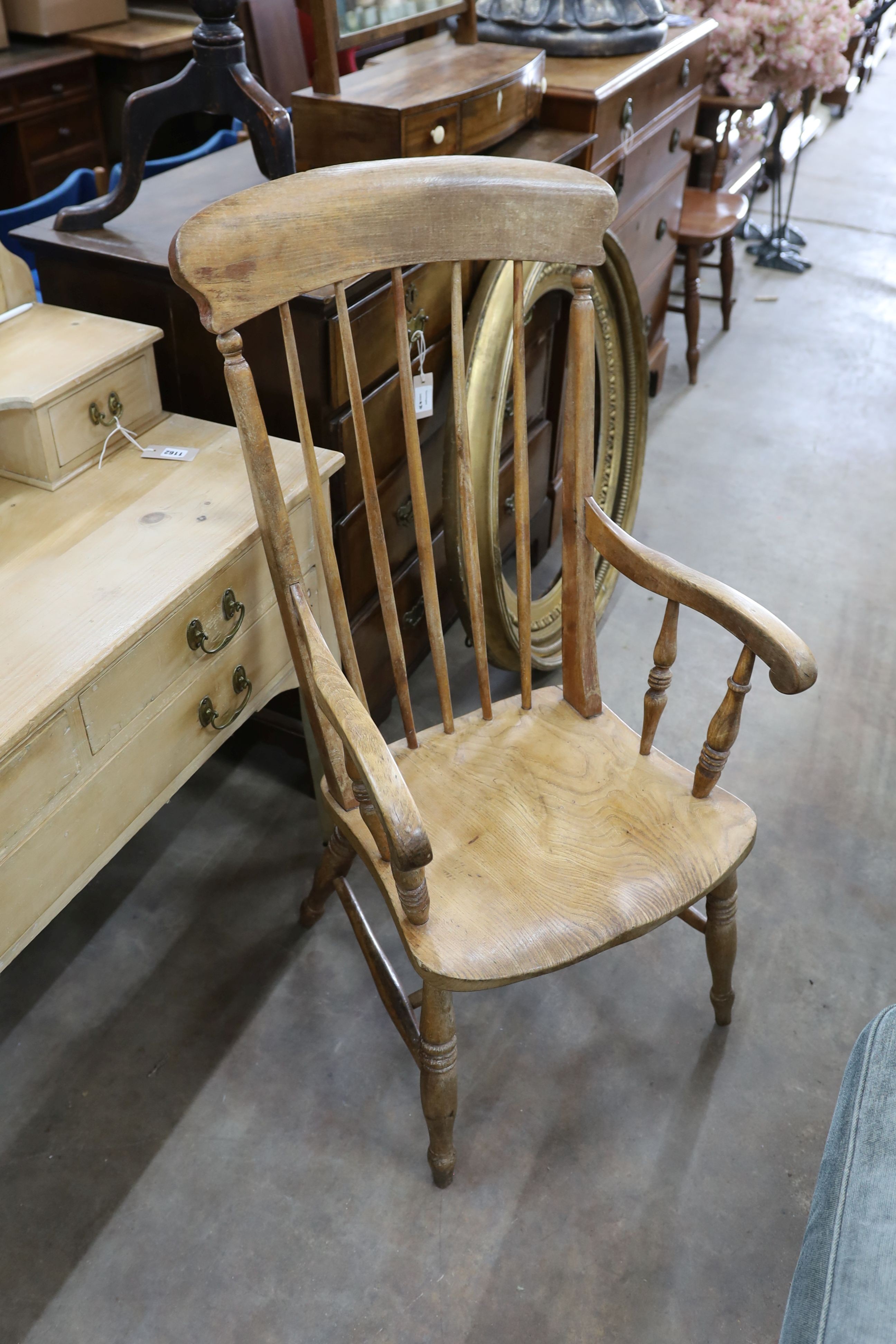 An Edwardian pine dressing table, width 106cm, depth 51cm, height 154cm together with a Victorian elm and beech Windsor armchair